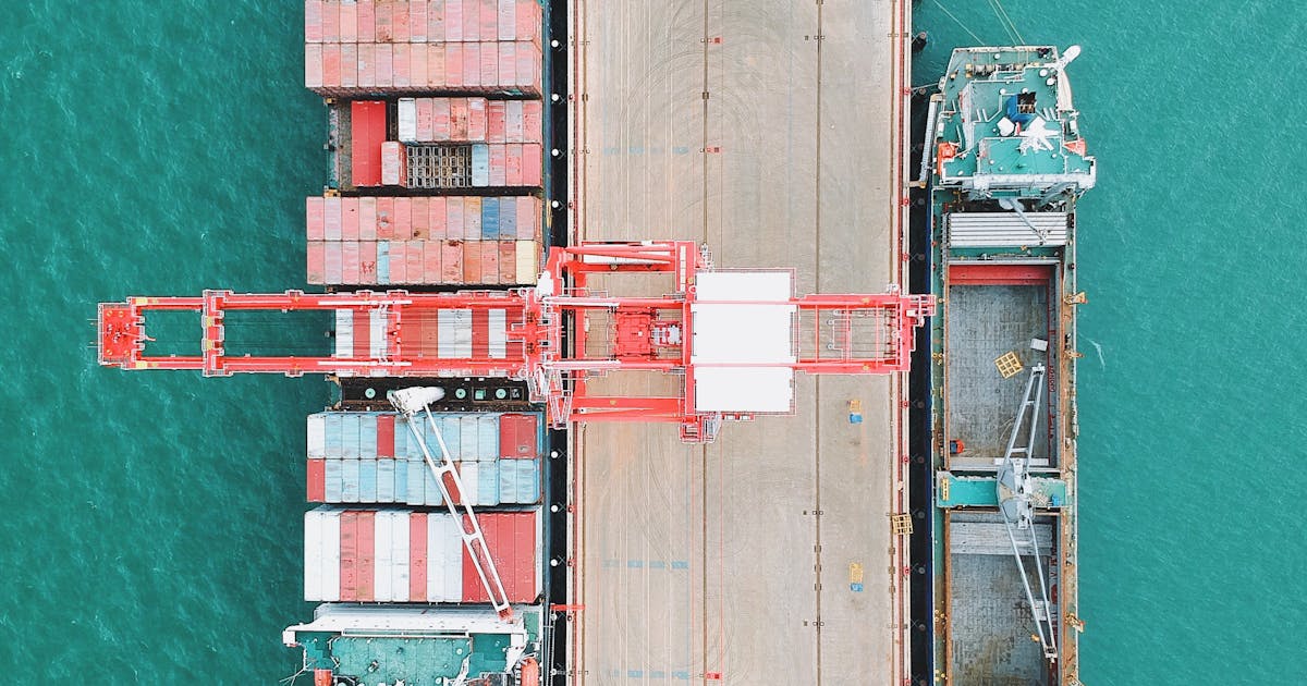 Container cargo ship docked at a port terminal