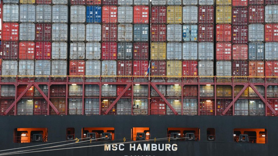 Shipping containers and export logistics scene related to compliance review.