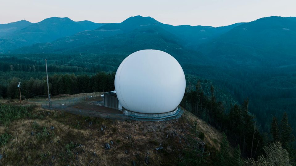 Radar installation overlooking a wide protected area for layered security planning.