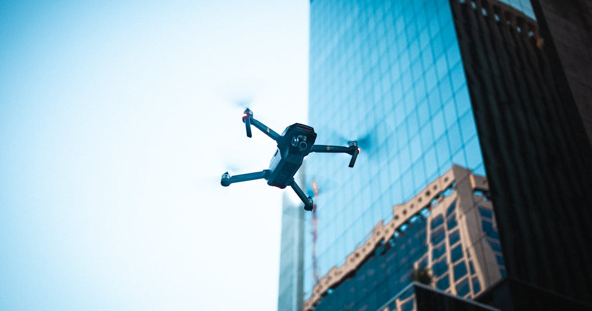 Drone flying near city skyscrapers